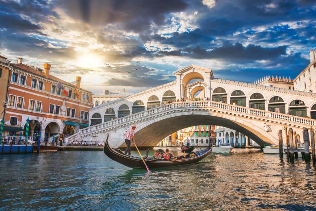 Traditional Gondola near world famous Canal Grande and Rialto Bridge